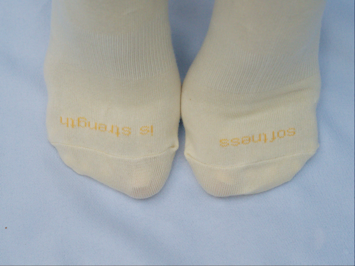 Yellow socks with blue daisy grips